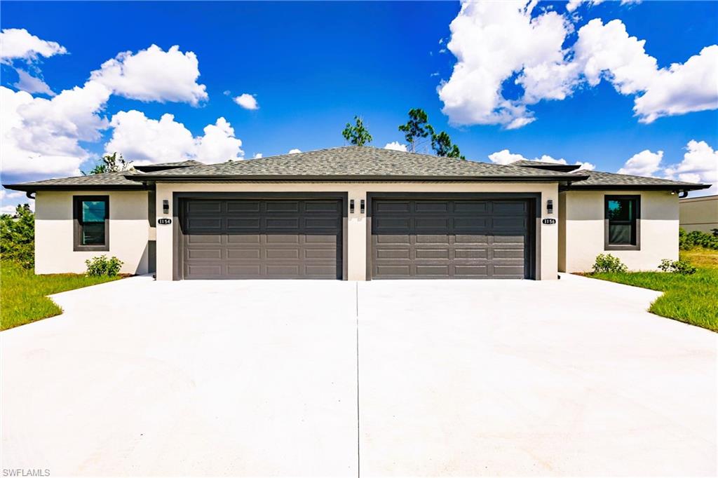 26395-26397 Explorer Road Punta Gorda, FL 33983 - Photo 1 of 18 a house view with a garden space
