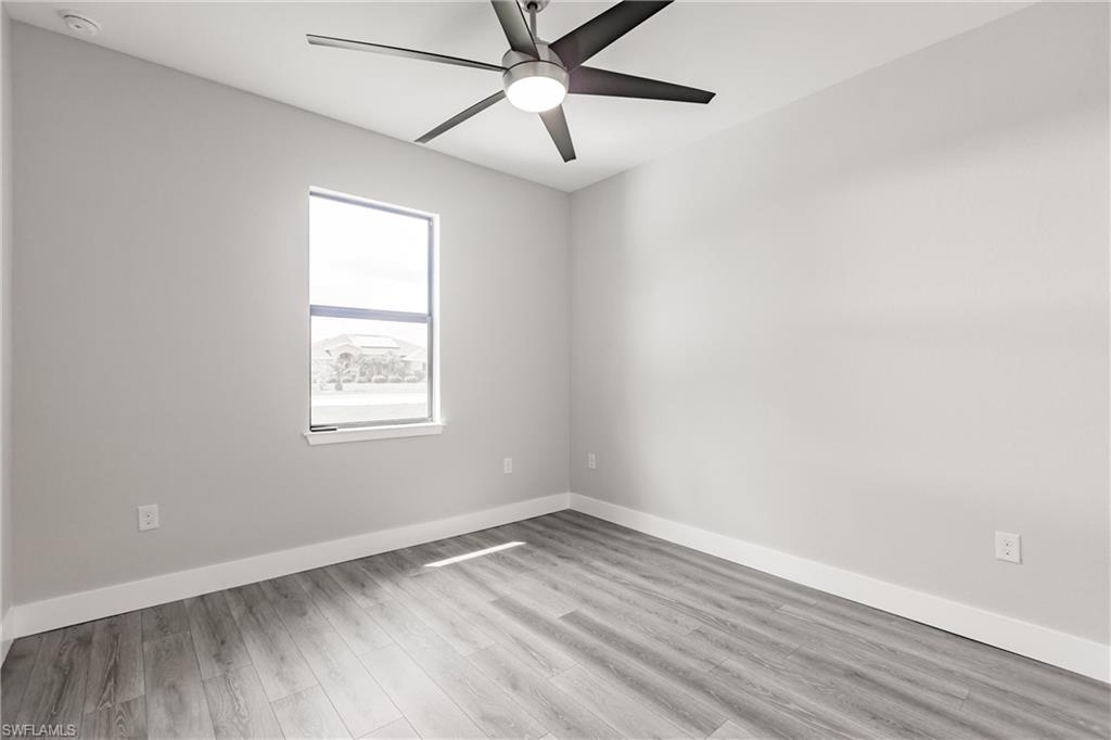 26395-26397 Explorer Road Punta Gorda, FL 33983 - Photo 12 of 18 an empty room with a window and a ceiling fan