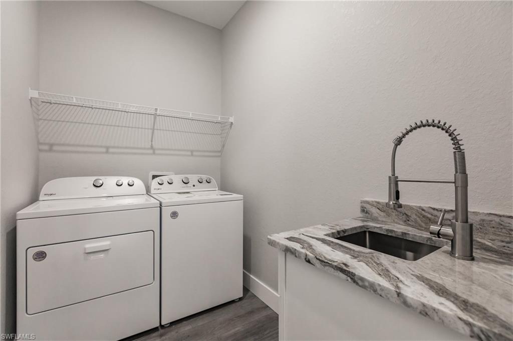 26395-26397 Explorer Road Punta Gorda, FL 33983 - Photo 15 of 18 a utility room with dryer and washer