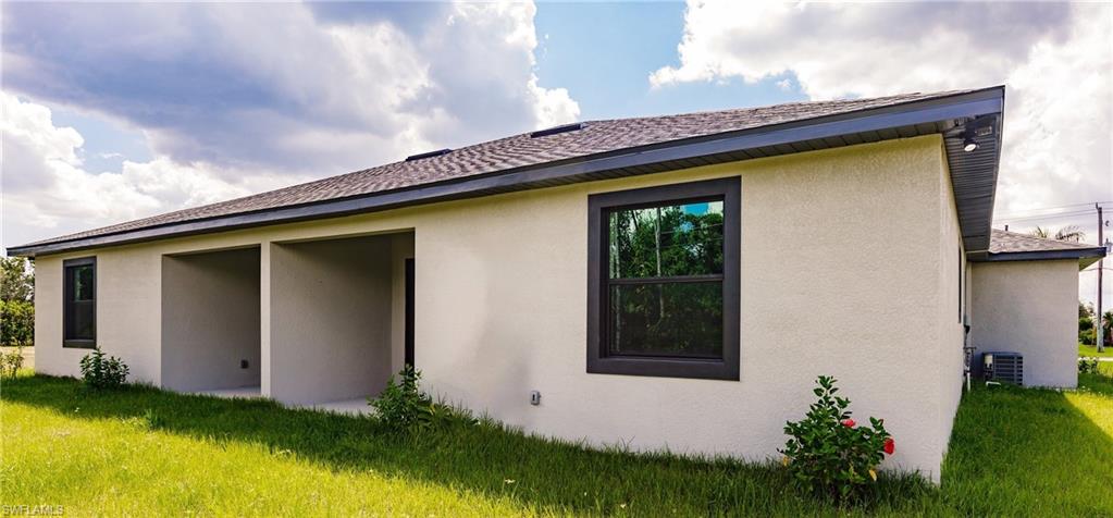 26395-26397 Explorer Road Punta Gorda, FL 33983 - Photo 18 of 18 a front view of a house with garden