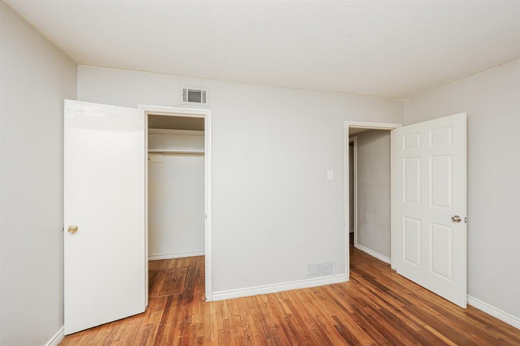 5175 Cardiff Street Dallas, TX 75241 - Photo 13 of 16 The room features hardwood flooring, light-colored walls, and white trim
