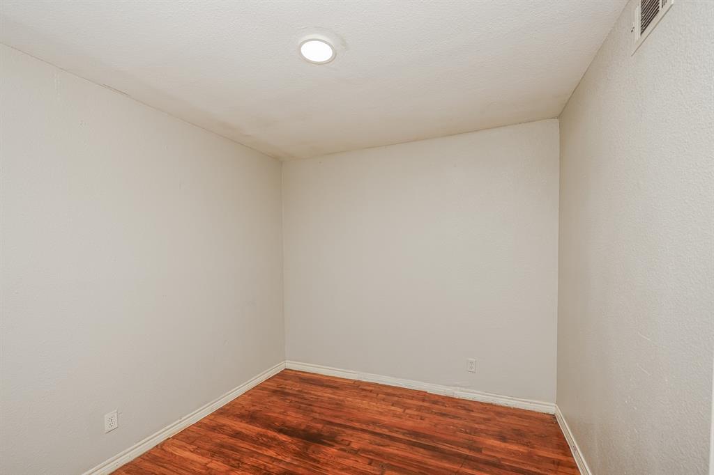 5175 Cardiff Street Dallas, TX 75241 - Photo 9 of 16 The room features hardwood floors and a recessed ceiling light fixture