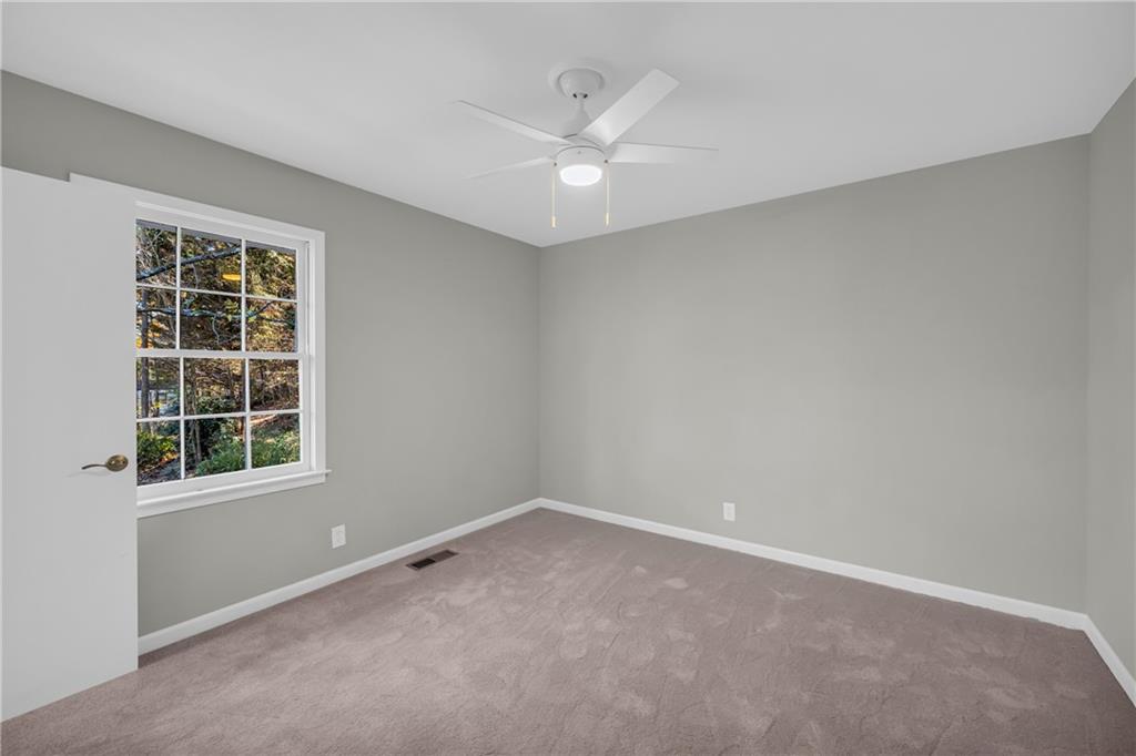 75 Cawthon Road Toccoa, GA 30577 - Photo 22 of 28 an empty room with windows and entrance