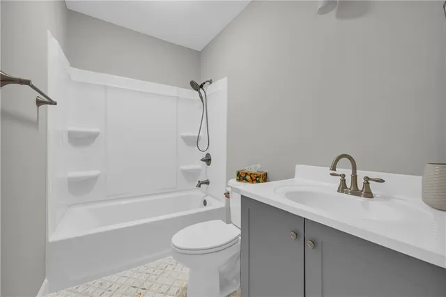 a bathroom with a sink a toilet and a bathtub