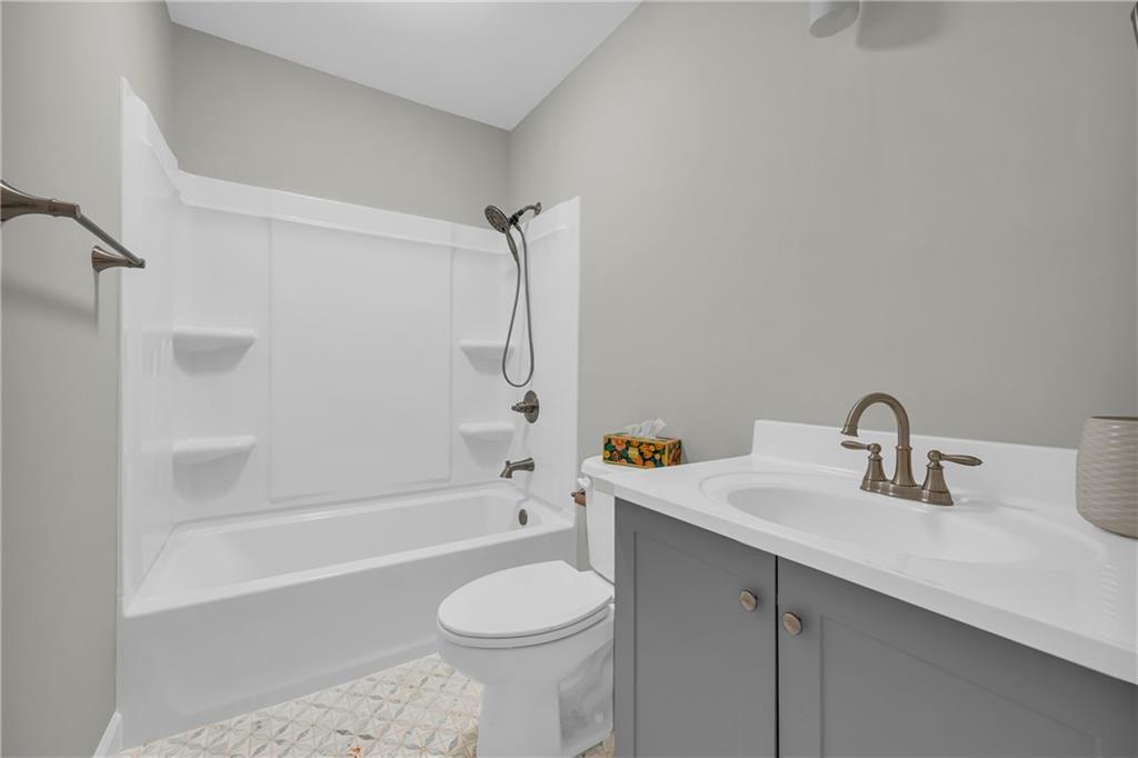 75 Cawthon Road Toccoa, GA 30577 - Photo 24 of 28 a bathroom with a sink a toilet and a bathtub