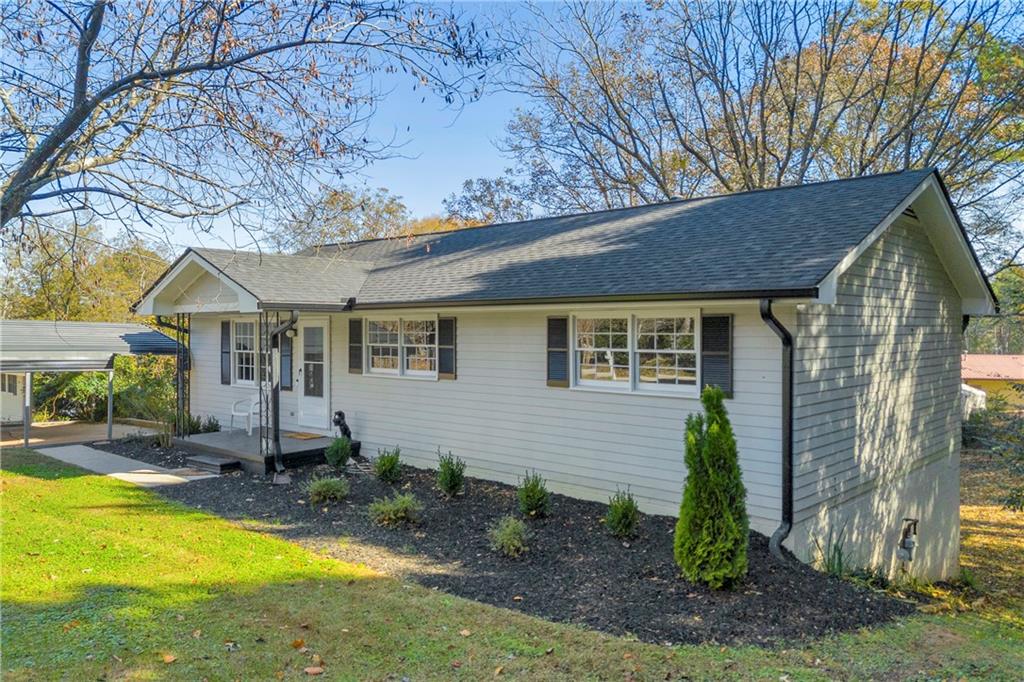 75 Cawthon Road Toccoa, GA 30577 - Photo 3 of 28 a view of a house with backyard and sitting area