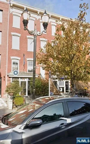 a view of balcony with two chairs and a table