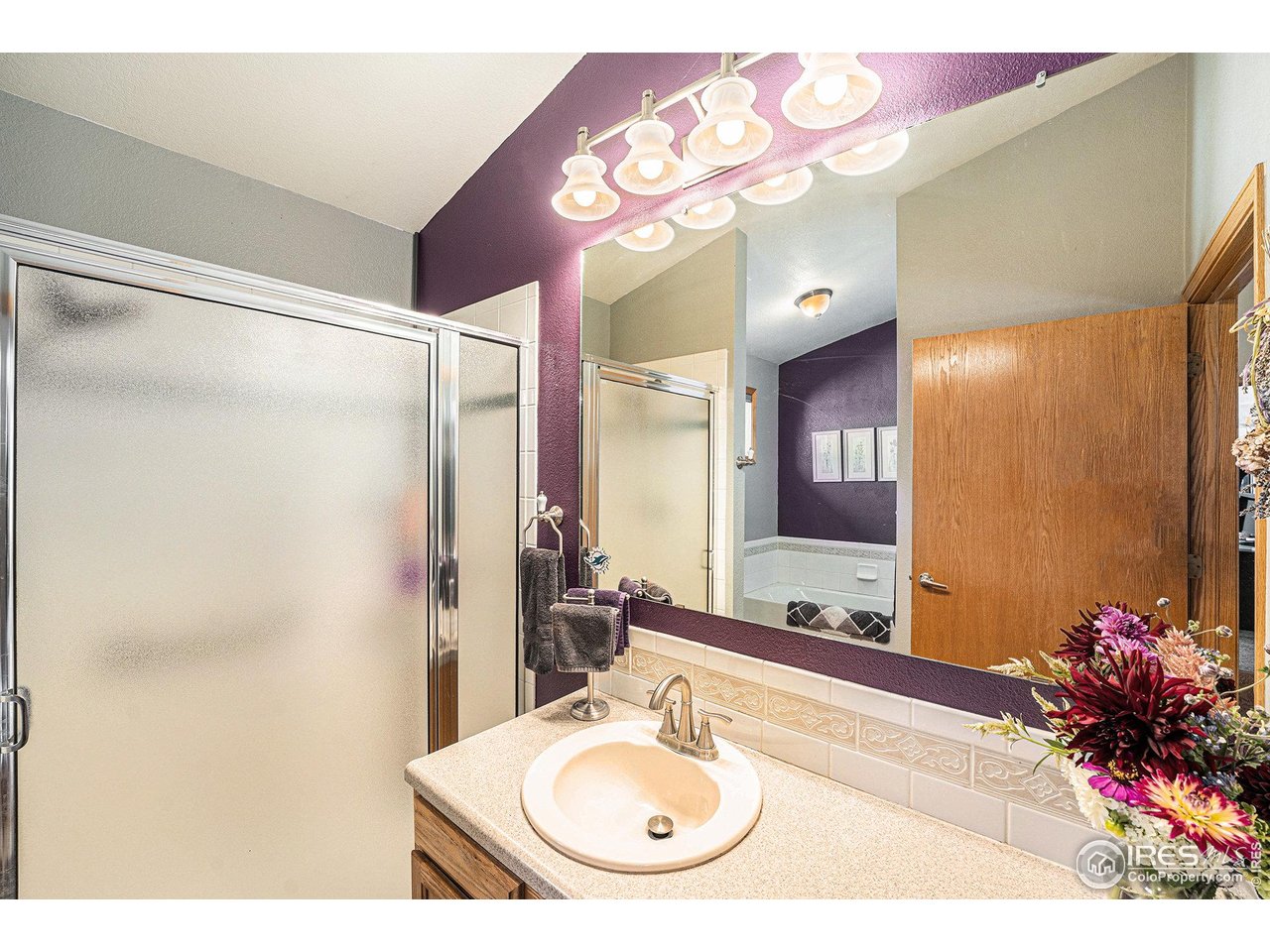712 Wade Road Longmont, CO 80503 - Photo 11 of 17 Large bath with tub and shower