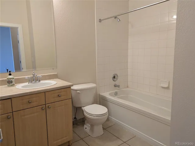 a bathroom with a toilet a sink and a bathtub