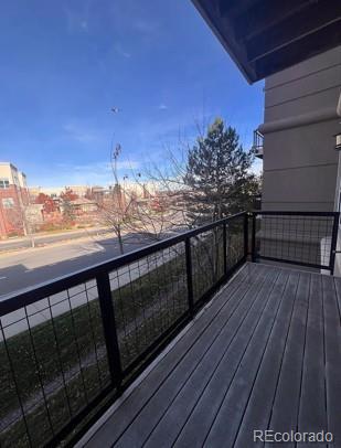 5677 South Park Place, Unit C204 Englewood, CO 80111 - Photo 12 of 13 a view of balcony with wooden floor