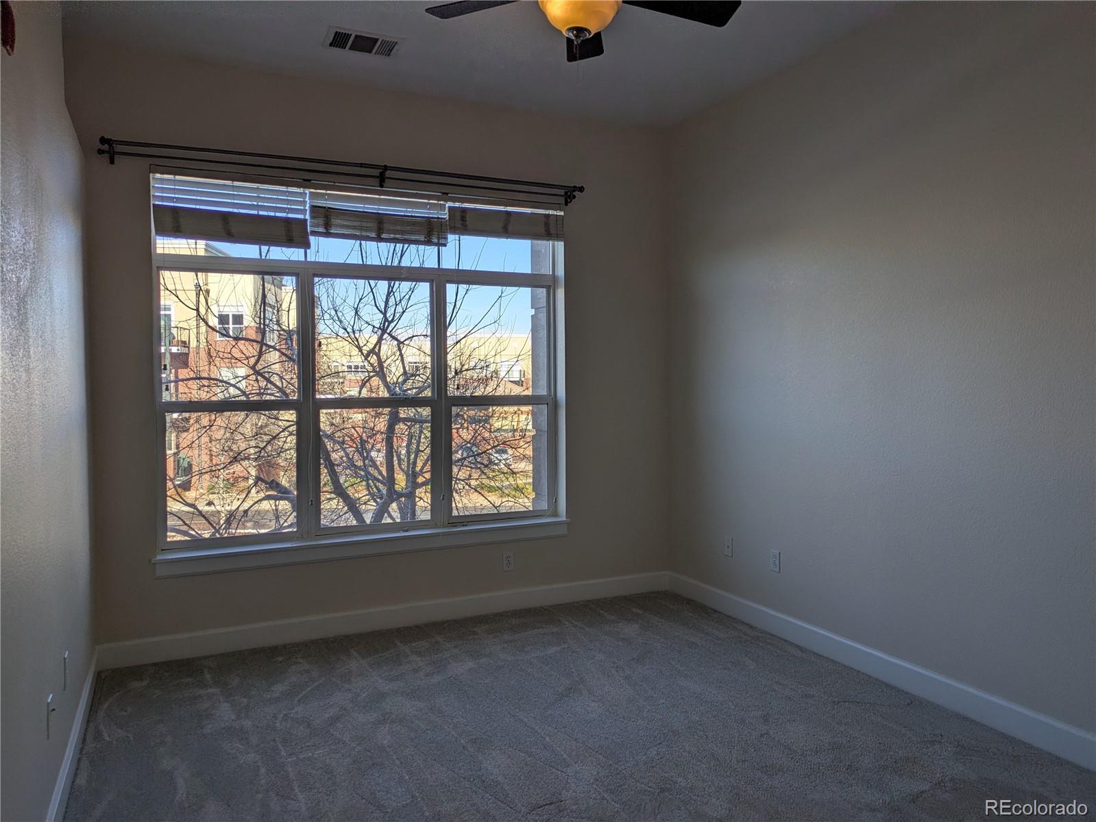 5677 South Park Place, Unit C204 Englewood, CO 80111 - Photo 8 of 13 an empty room with a window