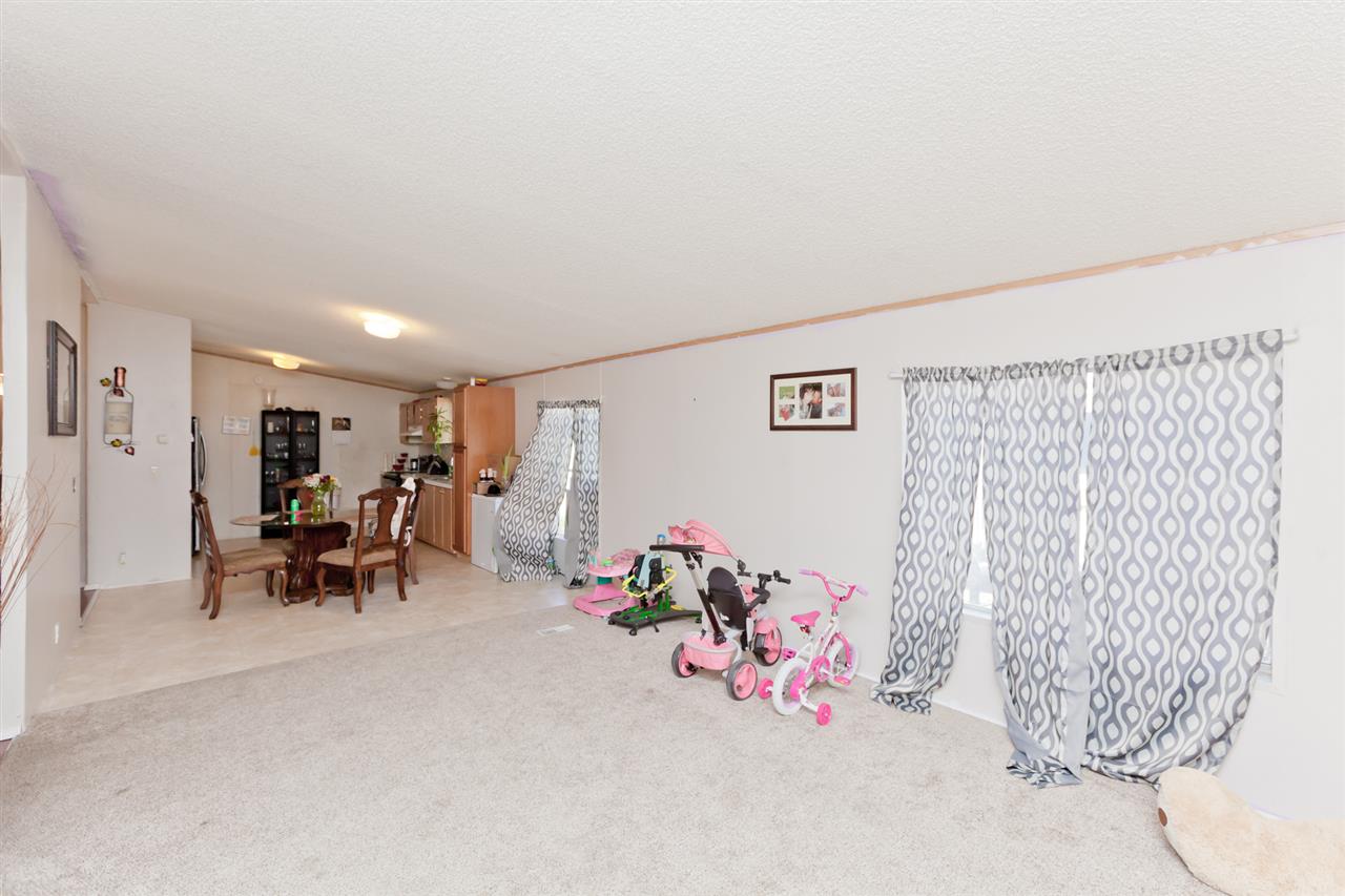424 32 Road, Unit 292 Clifton, CO 81520 - Photo 14 of 35 a view of a room with furniture and a chandelier