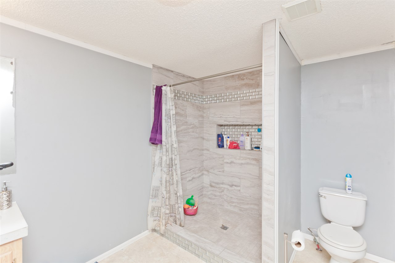424 32 Road, Unit 292 Clifton, CO 81520 - Photo 19 of 35 a bathroom with a shower a toilet and a shower curtain