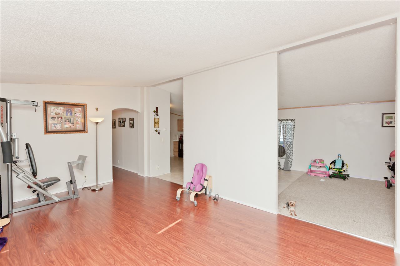 424 32 Road, Unit 292 Clifton, CO 81520 - Photo 2 of 35 a living room with furniture and wooden floor