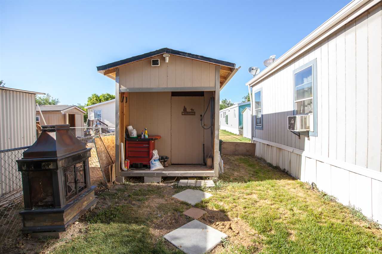 424 32 Road, Unit 292 Clifton, CO 81520 - Photo 34 of 35 a front view of a house with a yard