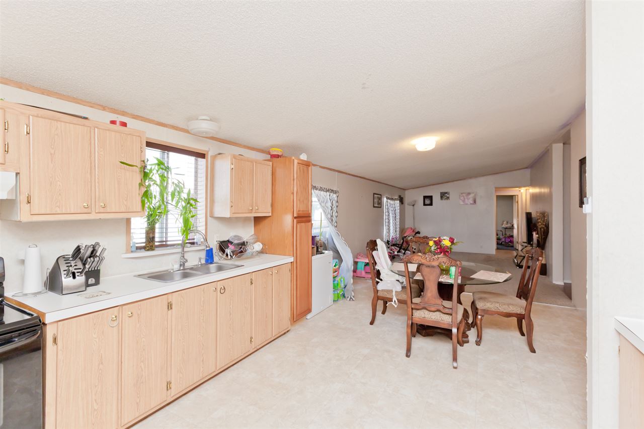 424 32 Road, Unit 292 Clifton, CO 81520 - Photo 9 of 35 a kitchen with a sink and a refrigerator