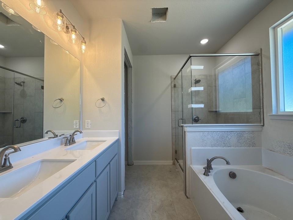 156 Oak Grv Way Springtown, TX 76082 - Photo 13 of 17 a bathroom with a tub sink and mirror