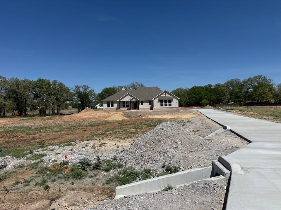 156 Oak Grv Way Springtown, TX 76082 - Photo 17 of 17 a view of a backyard