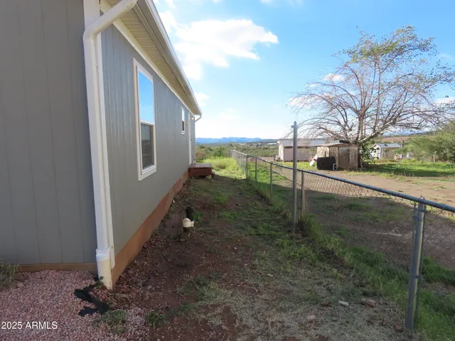 a view of backyard with tub