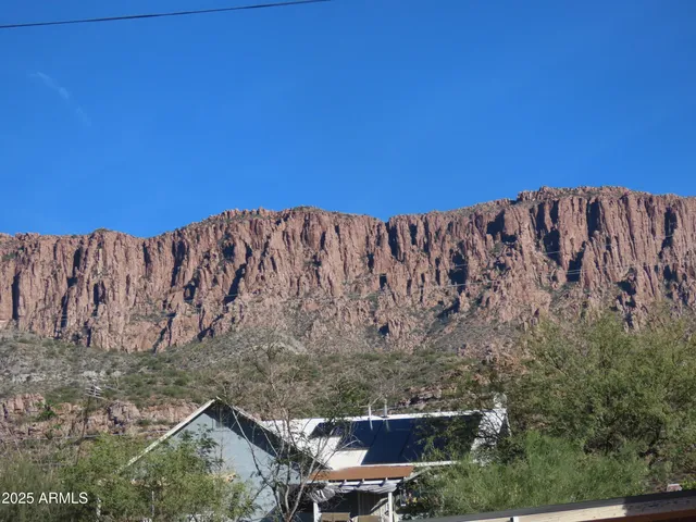 a view of a house with a yard and balcony