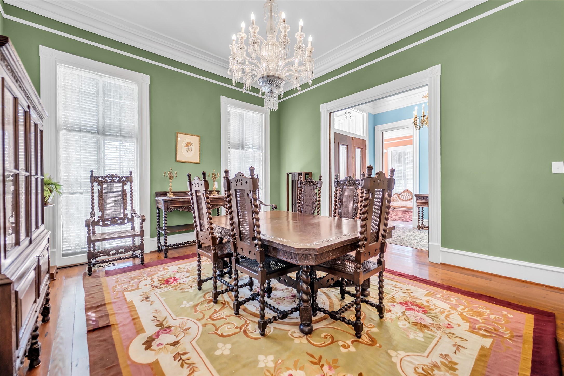 926 Winnie Street Galveston, TX 77550 - Photo 15 of 49 a view of a dining room with furniture and chandelier