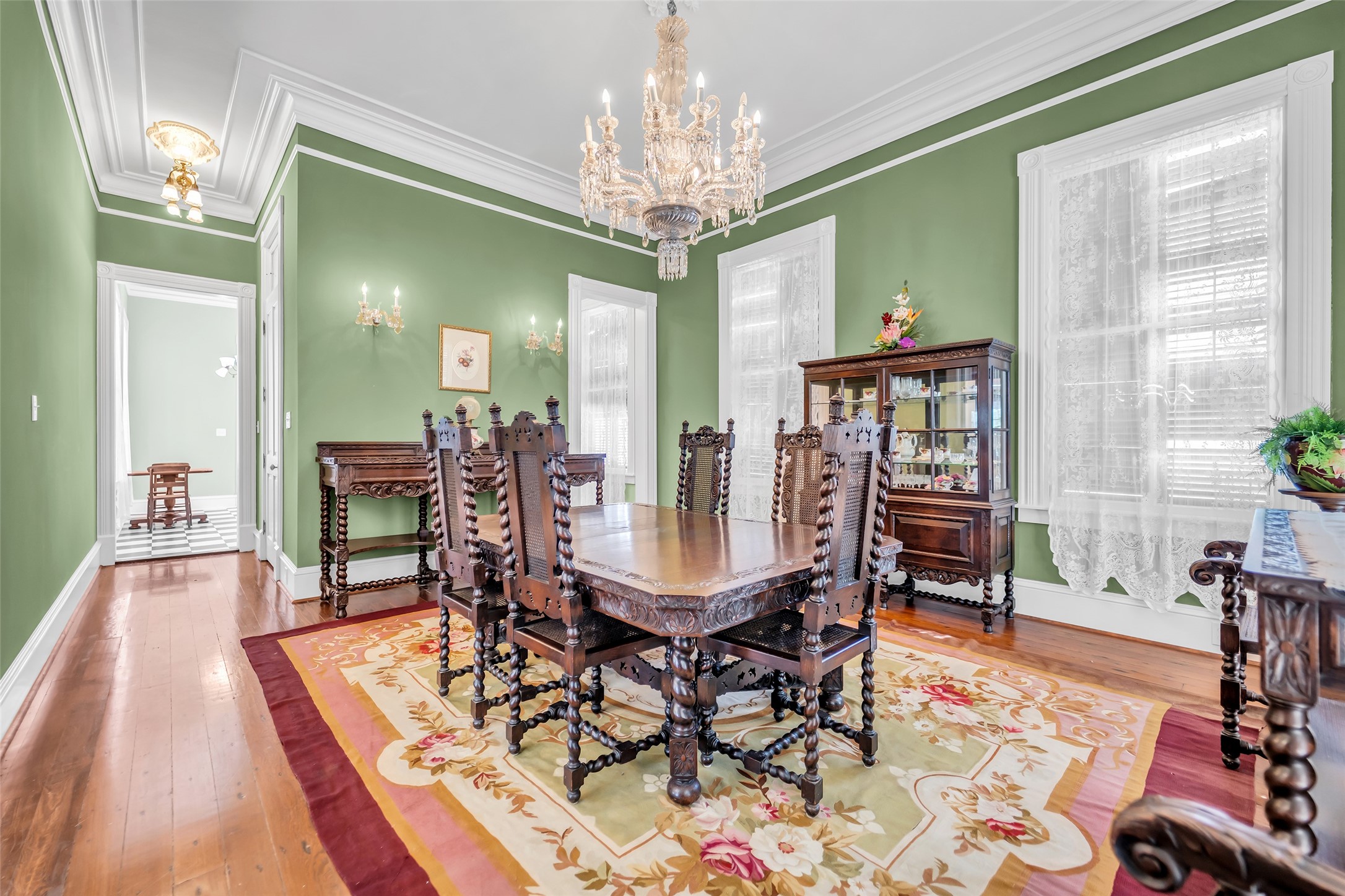 926 Winnie Street Galveston, TX 77550 - Photo 16 of 49 a view of a dining room with furniture and chandelier
