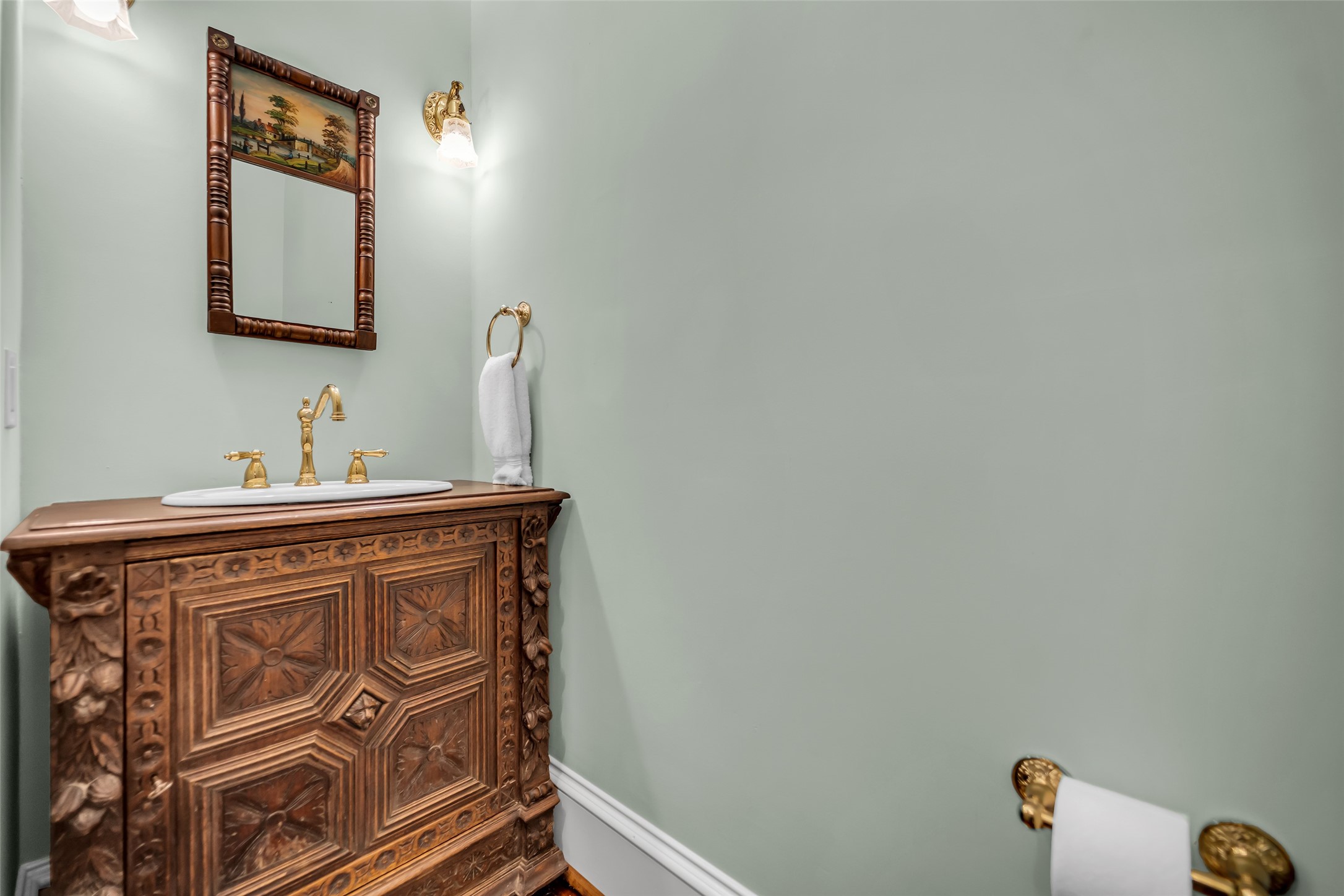 926 Winnie Street Galveston, TX 77550 - Photo 23 of 49 a bathroom with a sink and a mirror