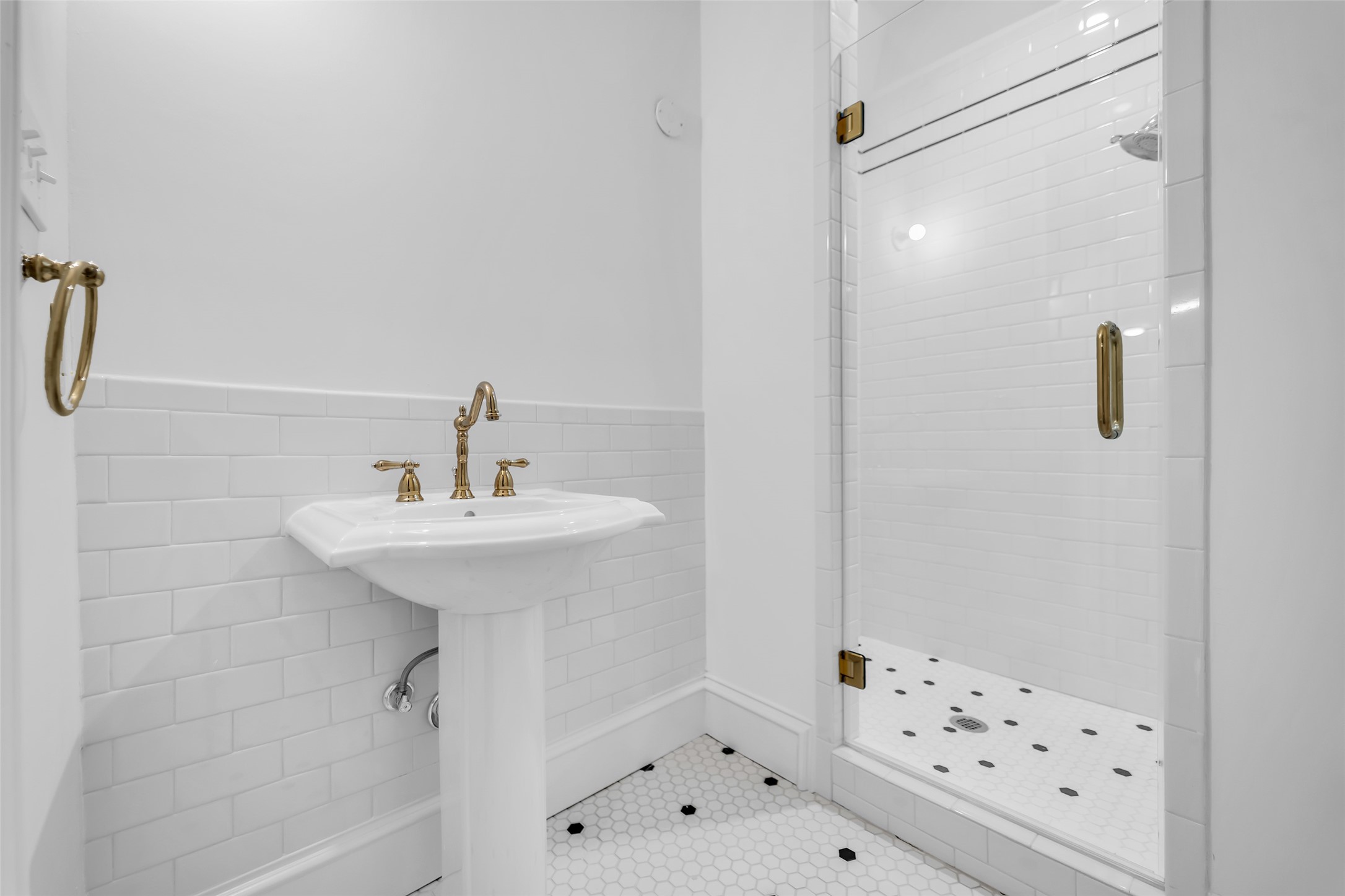 926 Winnie Street Galveston, TX 77550 - Photo 36 of 49 a bathroom with a sink and shower