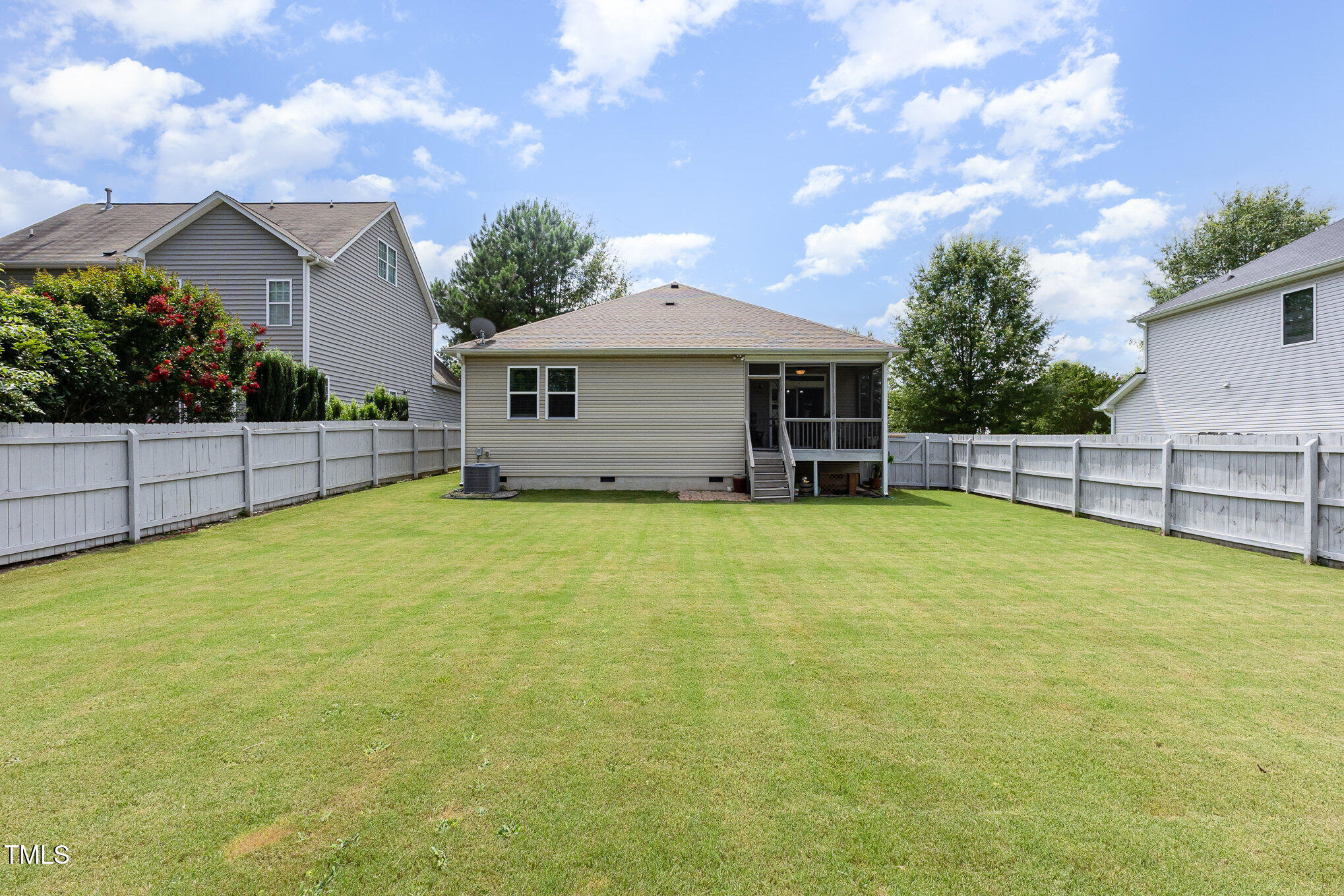 1205 Barnford Mill Road Wake Forest, NC 27587 - Photo 16 of 17 a view of a house with backyard and tree