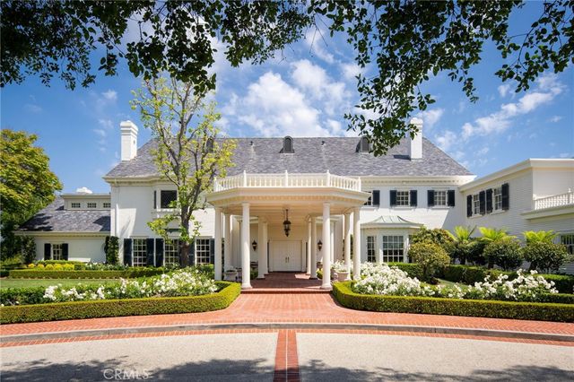 front view of a house with a garden