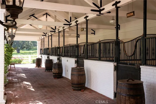 a view of a patio with table and chairs with wooden floor and fence