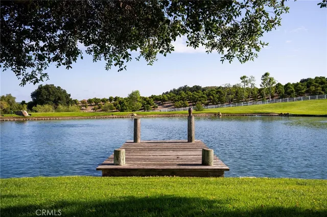 a view of a lake with houses in the back