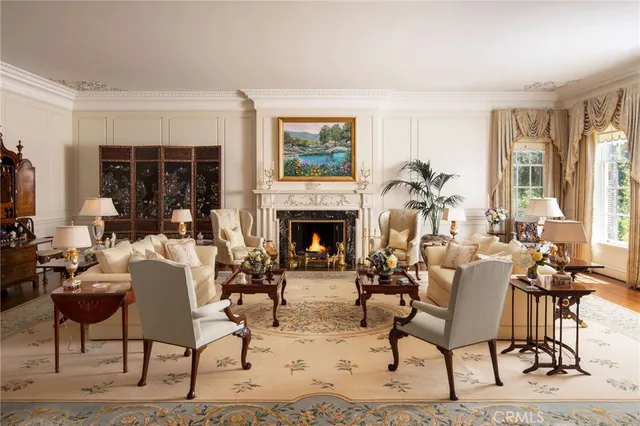 a living room with furniture a window and a fireplace