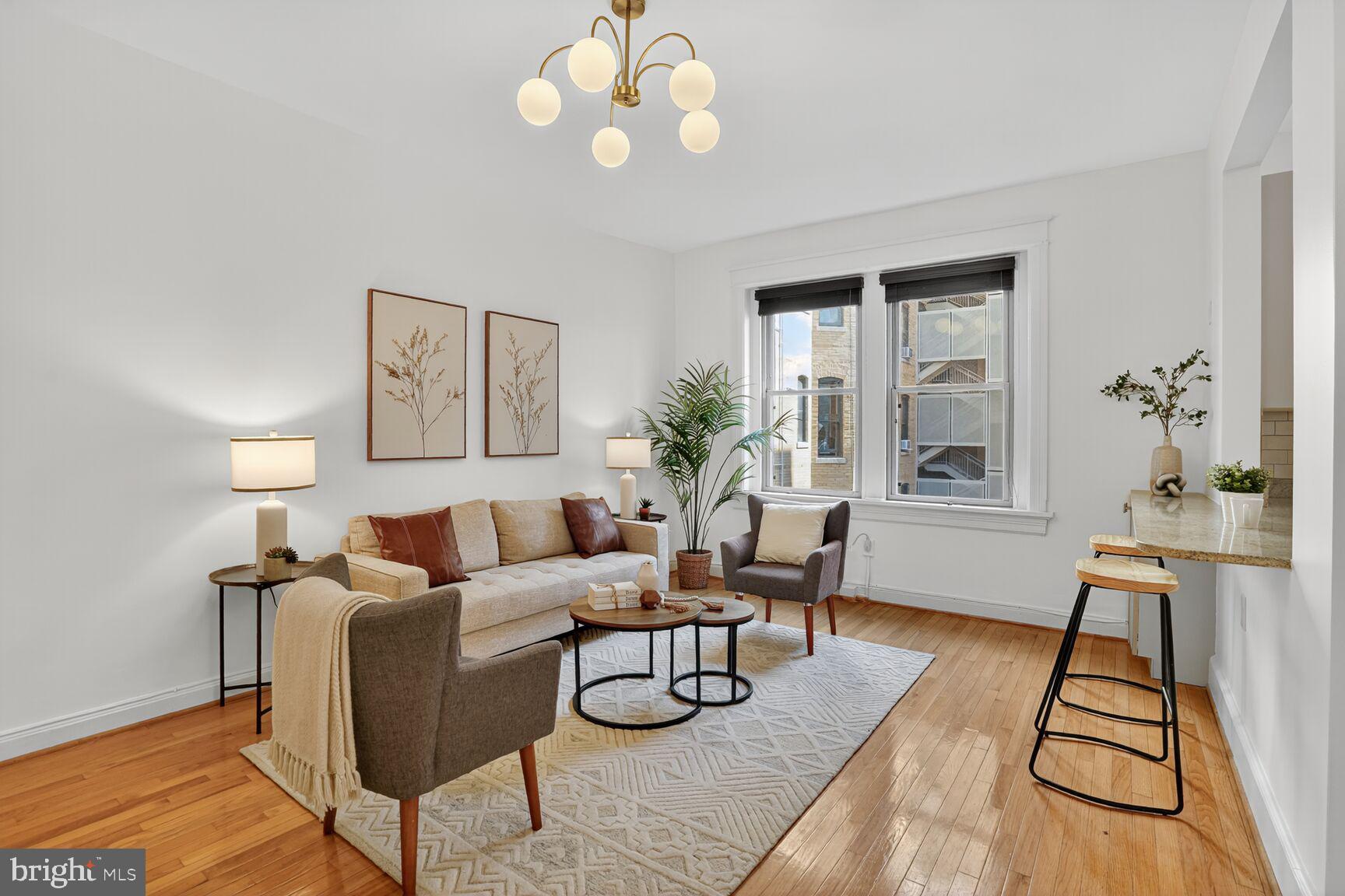 2010 Kalorama Road Northwest, Unit 506 Washington, DC 20009 - Photo 2 of 22 a living room with furniture and wooden floor