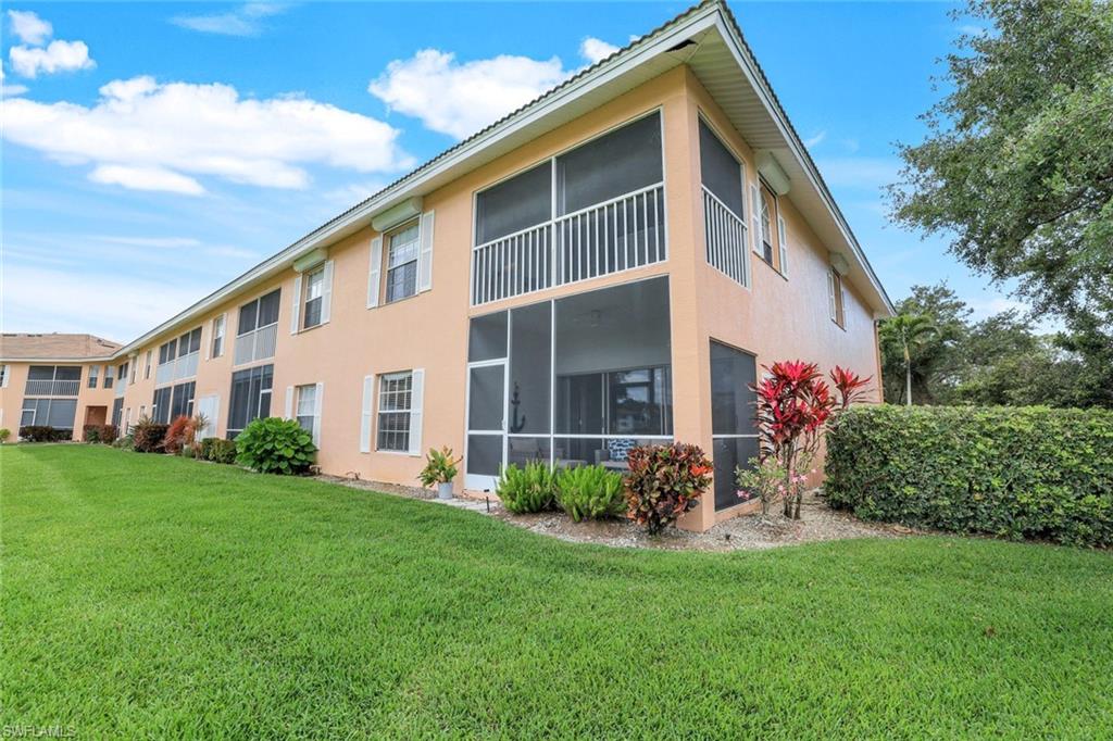 555 Augusta Boulevard, Unit 31 Naples, FL 34113 - Photo 17 of 17 a front view of a house with a yard