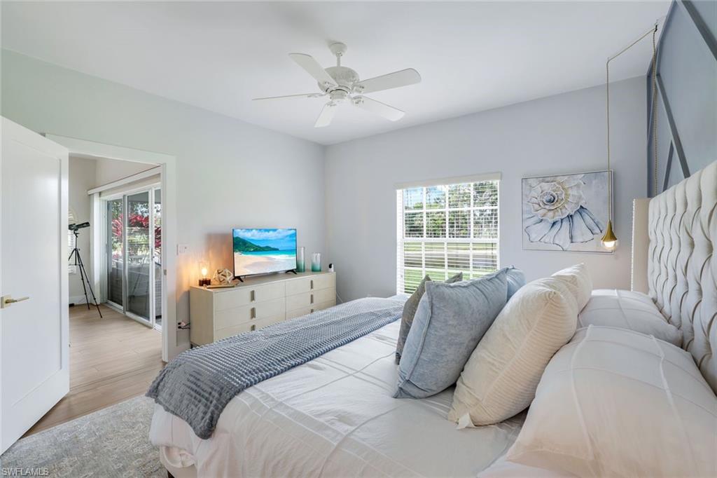 555 Augusta Boulevard, Unit 31 Naples, FL 34113 - Photo 10 of 17 a bedroom with a bed and a window