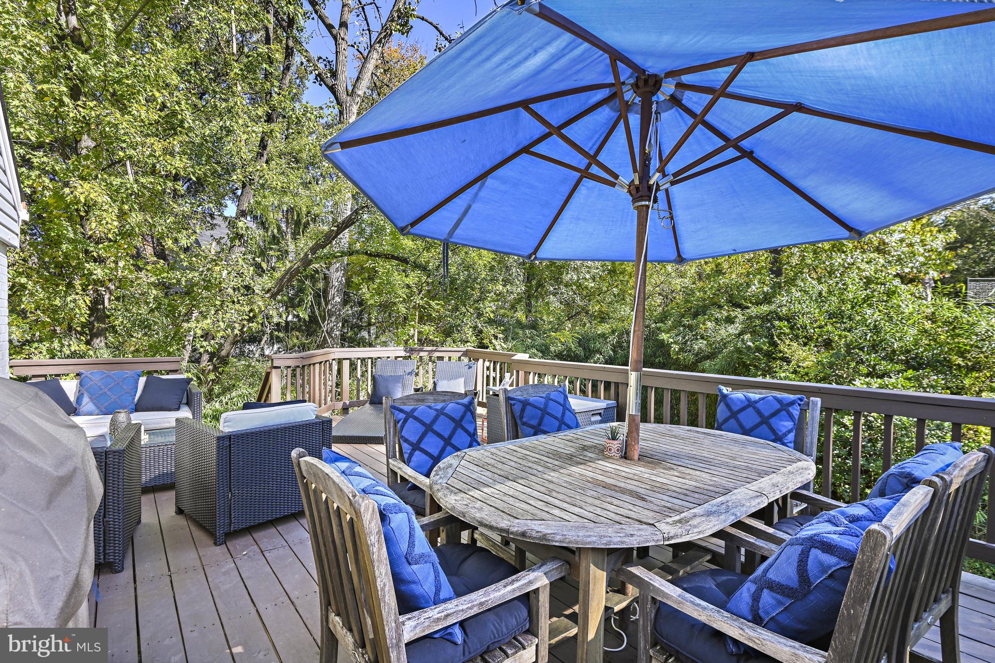 6602 Jerry Place McLean, VA 22101 - Photo 21 of 28 a balcony view with a table and chairs under an umbrella