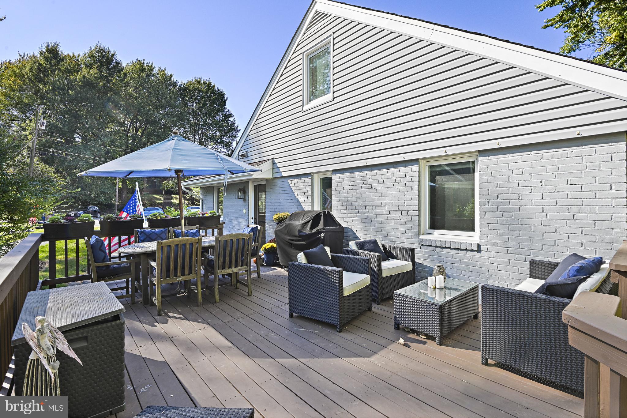 6602 Jerry Place McLean, VA 22101 - Photo 22 of 28 a view of a patio with couches and table and chairs with wooden floor