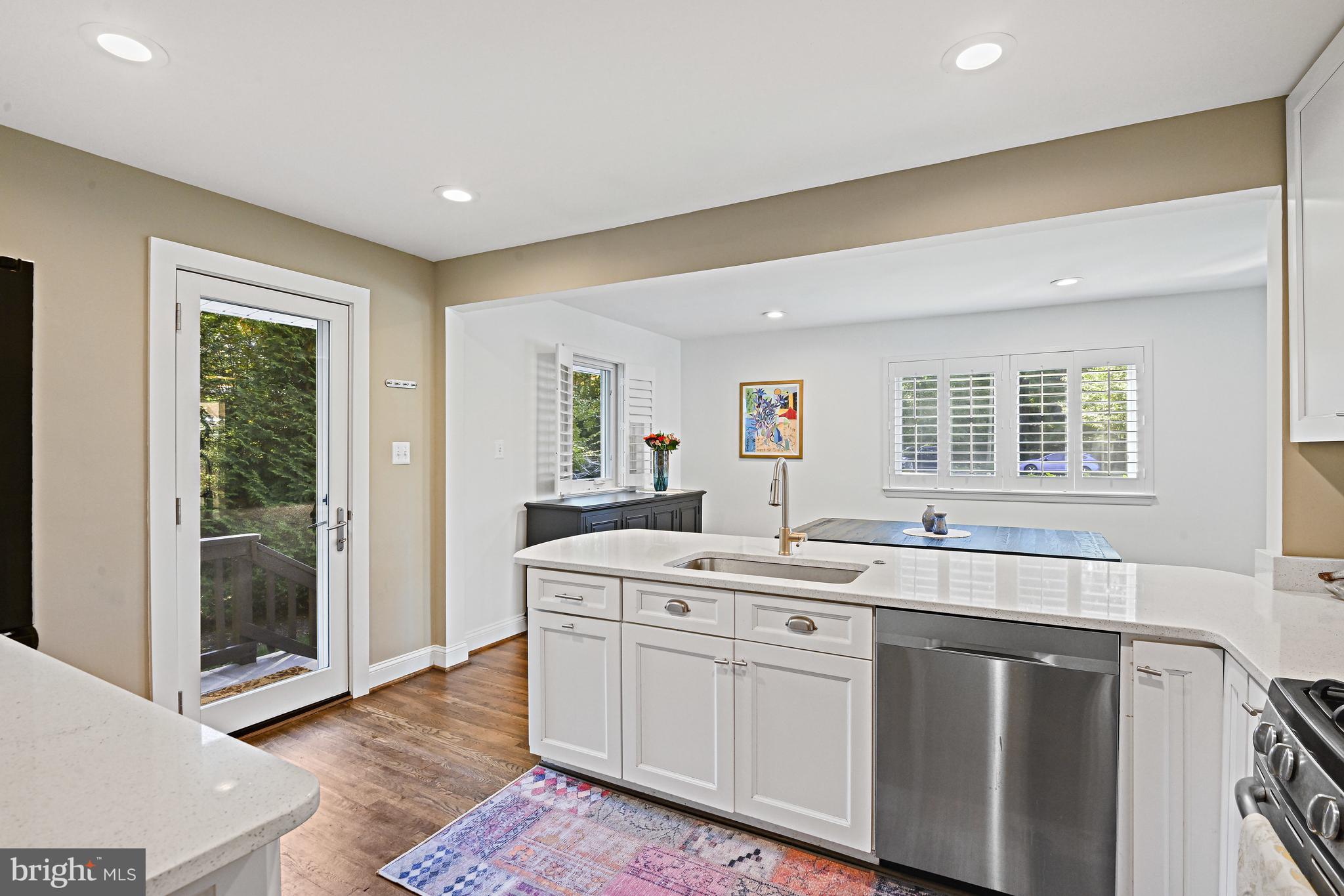 6602 Jerry Place McLean, VA 22101 - Photo 9 of 28 a kitchen with a sink stove and cabinets