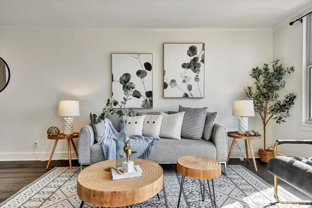 a living room with furniture and a table