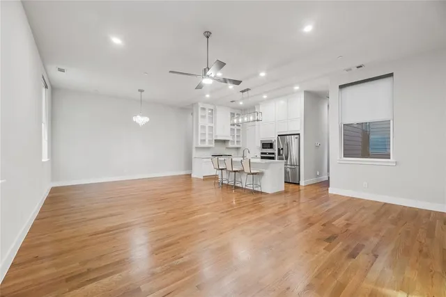 a view of a kitchen with a sink and a stove top oven