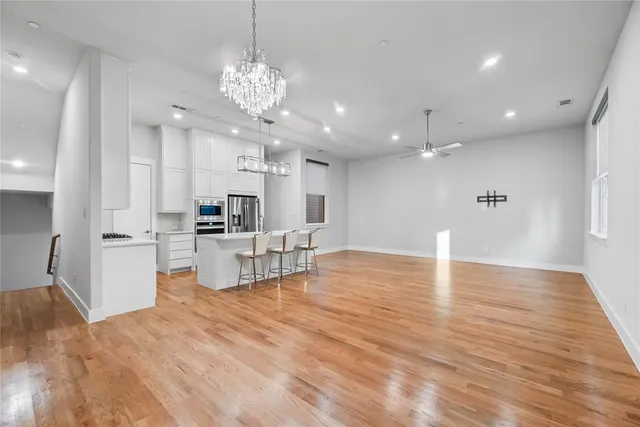 a view of kitchen with cabinets and wooden floor