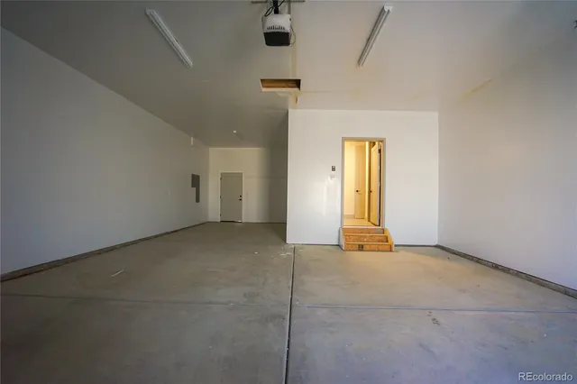 a view of empty room with ceiling fan