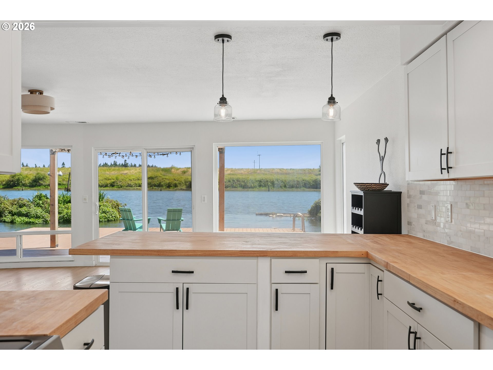 14936 Northwest Mill Road, Unit K Portland, OR 97231 - Photo 7 of 33 a kitchen with a sink and a large window