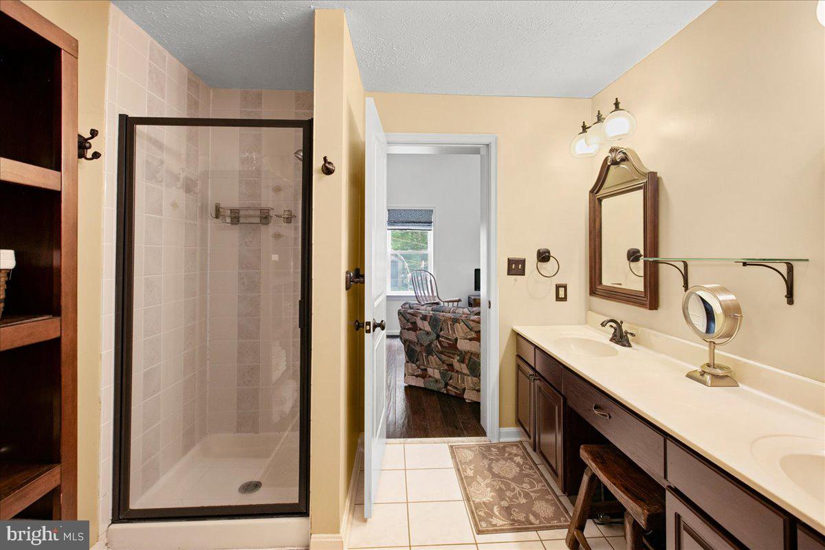 19266 Mockingbird Heights Road Triangle, VA 22172 - Photo 20 of 35 a bathroom with a sink and a mirror