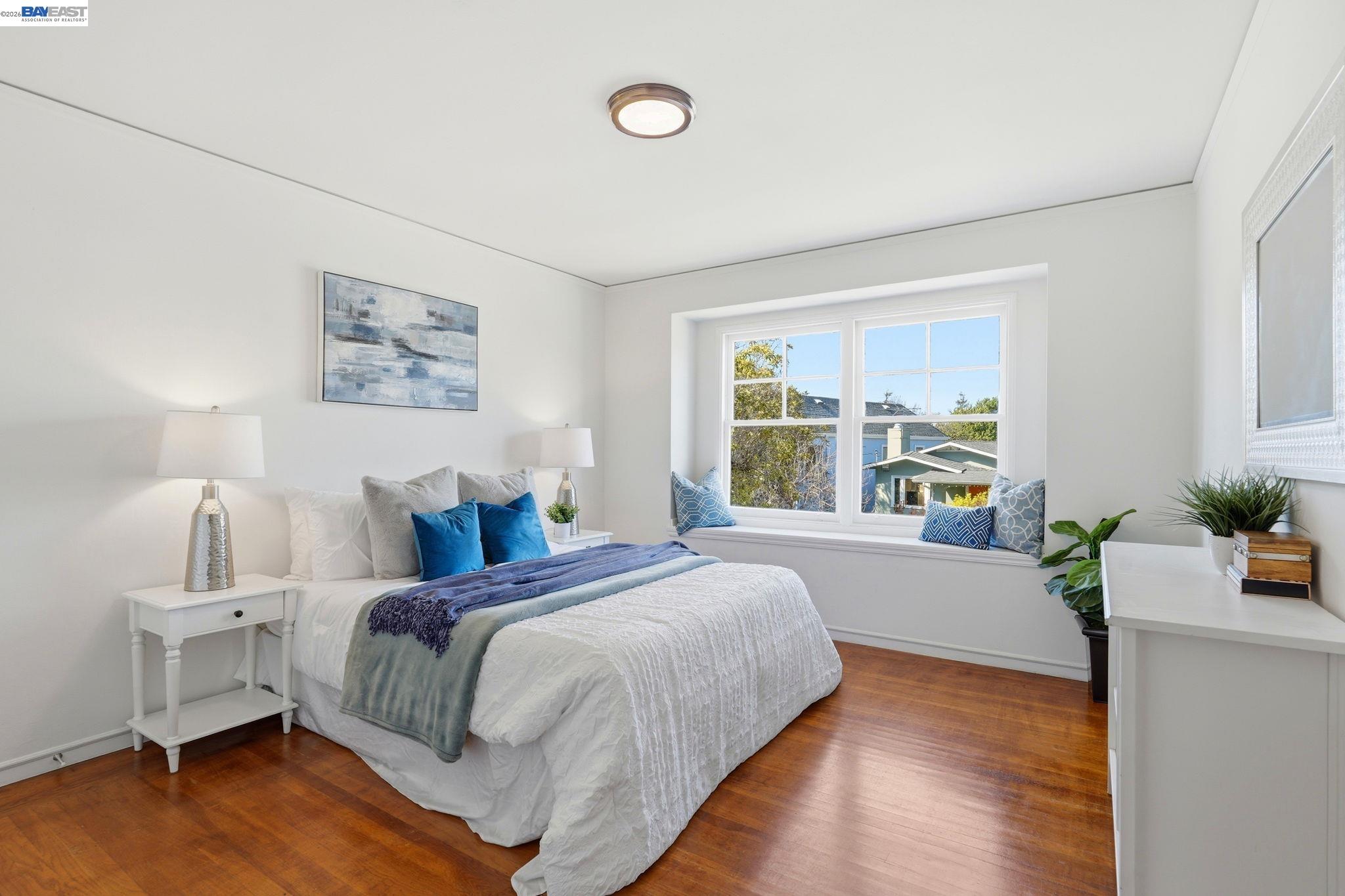 1368 Rose Street Berkeley, CA 94702 - Photo 11 of 21 a spacious bedroom with a bed and a table