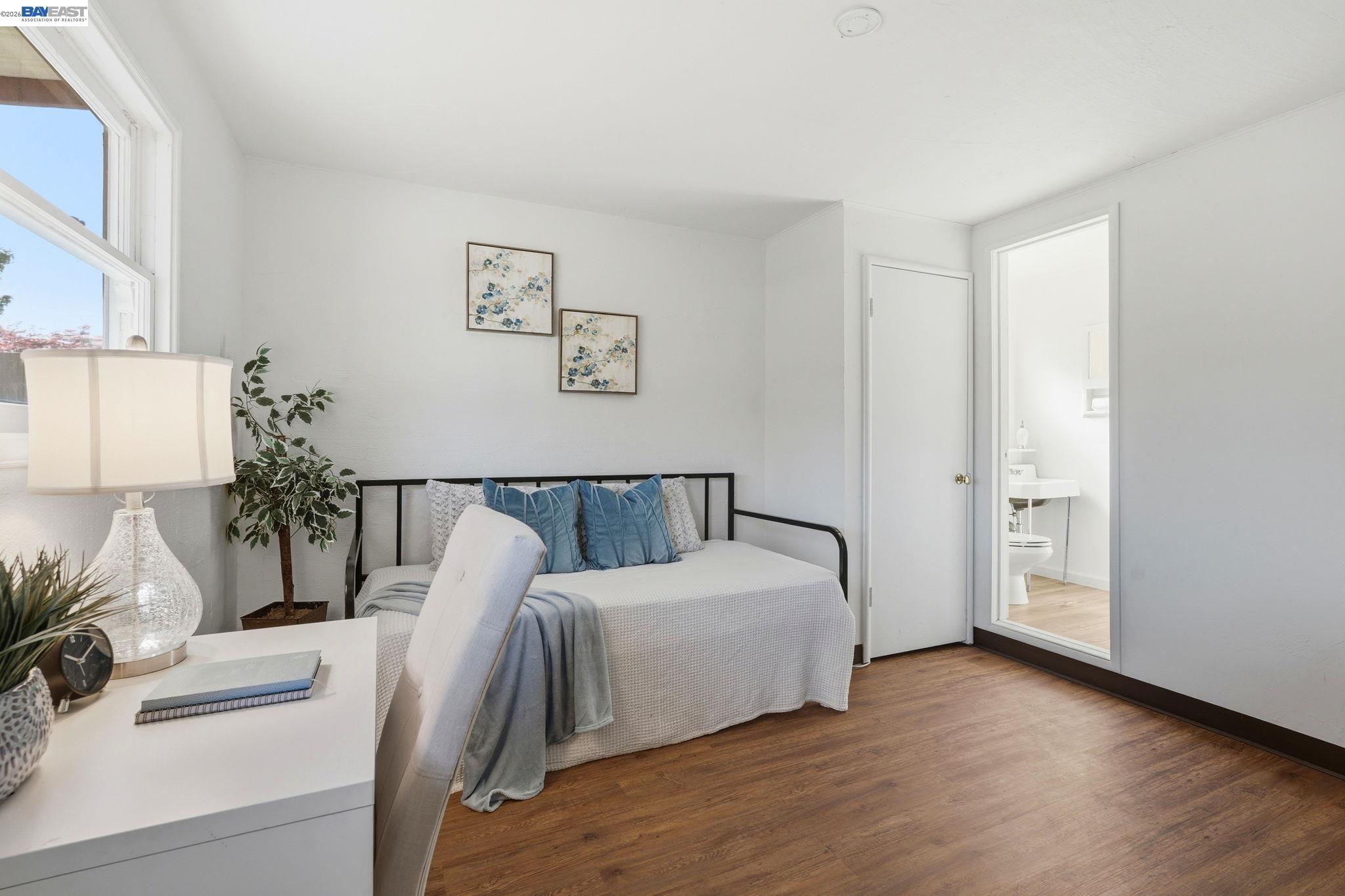 1368 Rose Street Berkeley, CA 94702 - Photo 14 of 21 a bed room with a bed and a couch