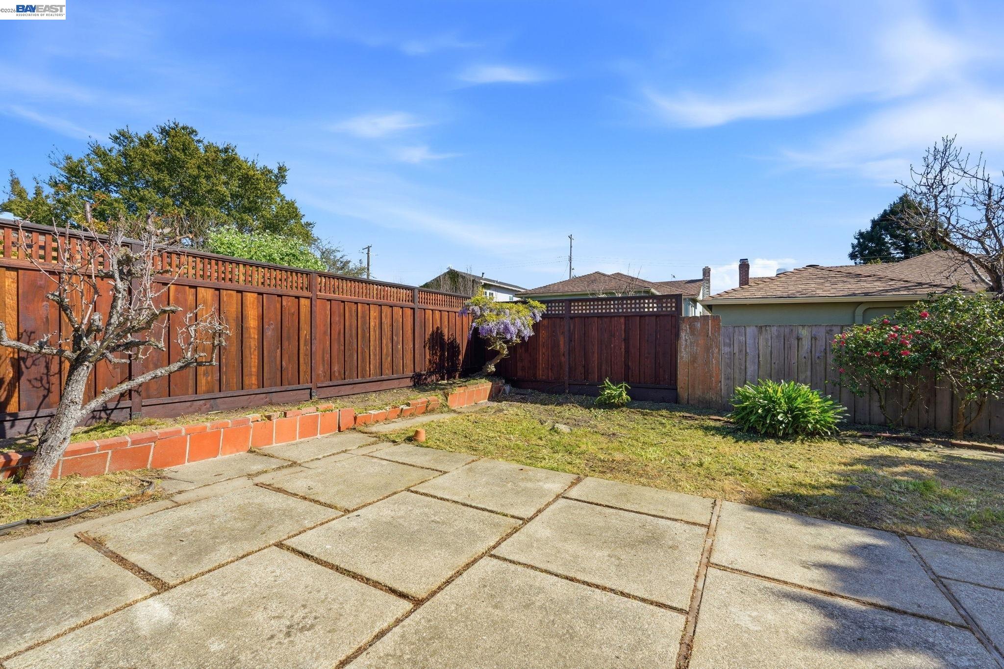 1368 Rose Street Berkeley, CA 94702 - Photo 17 of 21 a backyard of a house with table and chairs