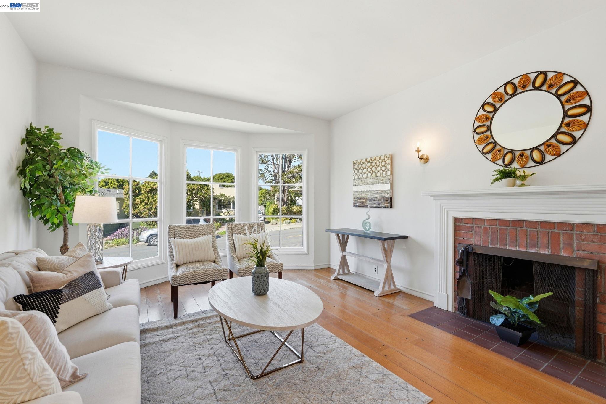 1368 Rose Street Berkeley, CA 94702 - Photo 3 of 21 a living room with furniture a fireplace and a large window