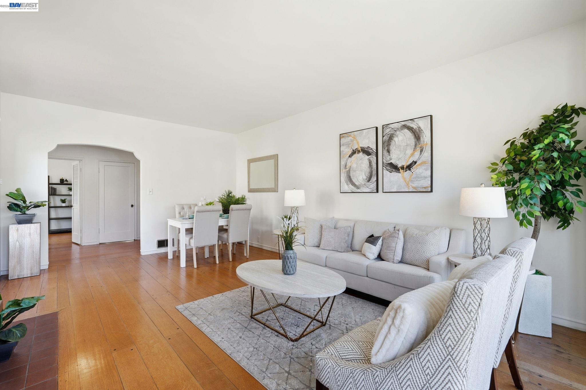 1368 Rose Street Berkeley, CA 94702 - Photo 4 of 21 a living room with furniture and wooden floor